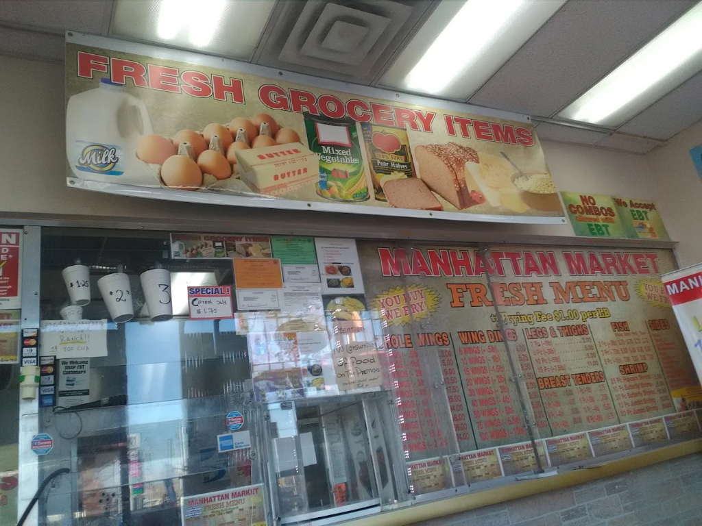 Fresh Grocery Items banner above hot food menu with We Accept EBT sign at Manhattan Market